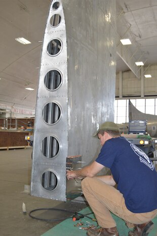 DAYTON, Ohio (08/2014) -- Restoration specialist Chad Vanhook works on the B-17F "Memphis Belle" in the restoration hangar at the National Museum of the U.S. Air Force. (U.S. Air Force photo)