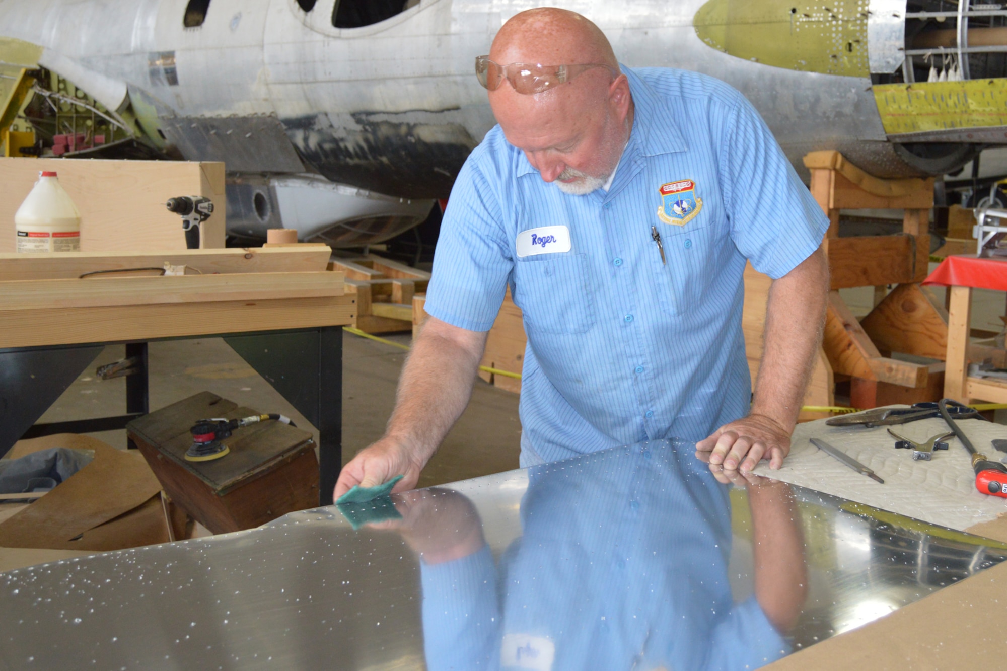 DAYTON, Ohio (08/2014) -- Restoration specialist Roger Brigner works on the B-17F "Memphis Belle" in the restoration hangar at the National Museum of the U.S. Air Force. (U.S. Air Force photo)