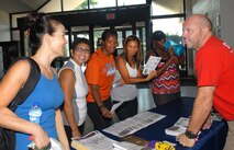 Scott Peavy, 78th Force Support Squadron recreation assistant, talks with the members of Team Robins during 70 Day Fit 4 Life Challenge kick-off at the main base gym Aug. 22. (U.S. Air Force photo by Misuzu Allen)


