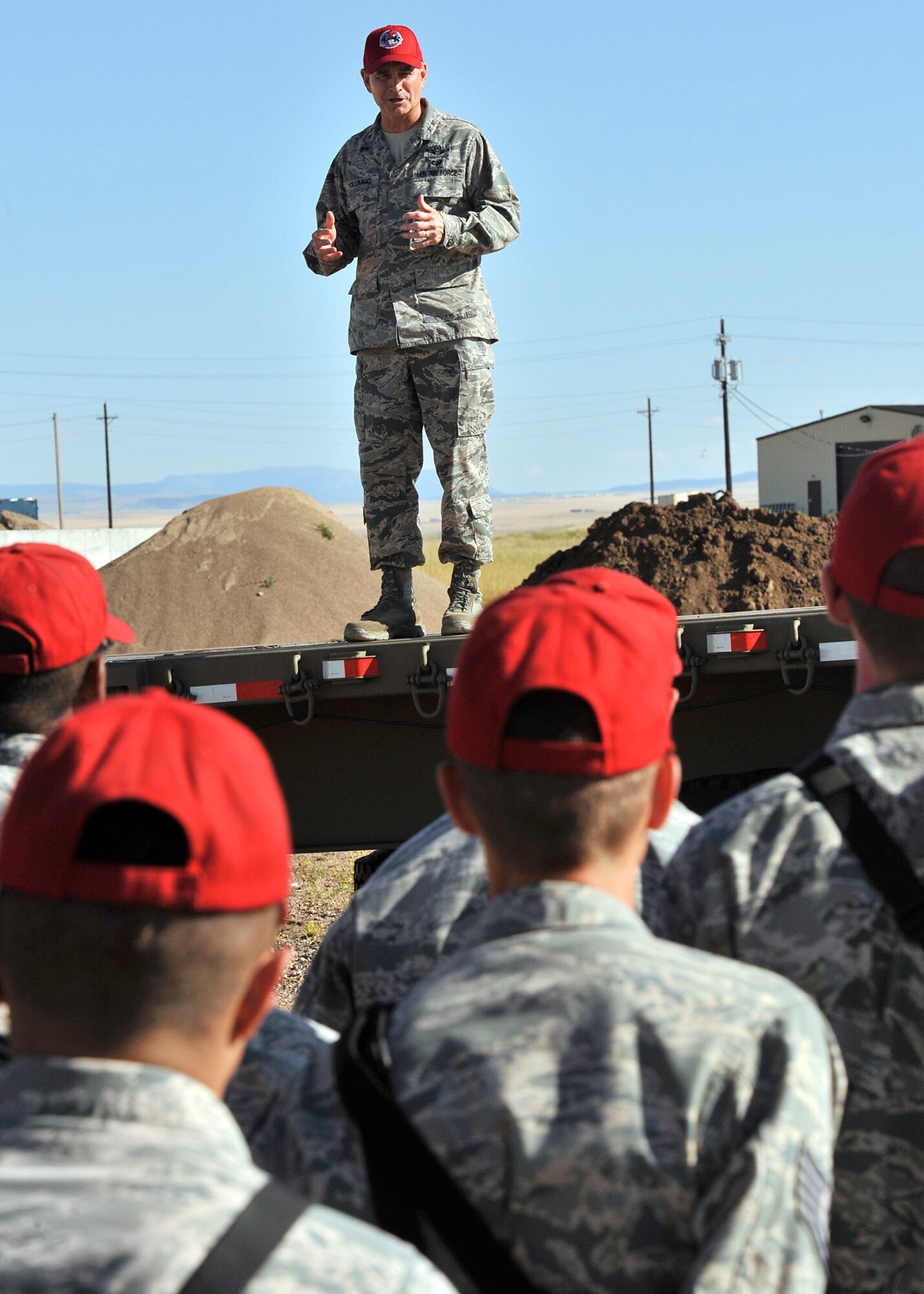 Maj. Gen. H.D. Polumbo, 9th Air Force commander, speaks to a formation of 819th RED HORSE Squadron Airmen Aug. 26 during the squadron’s phase II field training exercise. Polumbo was at Malmstrom Air Force Base, Mont., Aug. 25-27 to visit the 819th RHS and tour the 341st Missile Wing’s nuclear mission. (U.S. Air Force photo/John Turner)