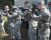 Seventy Eighth Security Forces Squadron Airmen conducted Shoot, Move and Communicate, and Combatives training at the EOD Range and fitness center annex respectively Aug. 19 and 21, 2014. During the SMC training, Airmen hone their skills on how to react. Participants go over different firing positions, fighting stances, maneuvers and communications while targeting the enemy.

Combatives training includes self defense, weapons retention, hand-to-hand combat, submission holds and non-lethal techniques and strikes. The two-part training starts in the morning with intense warm-ups and stretching, followed by basic fighting techniques, including a light sparring session with a partner to recap all of the techniques taught as it applies in use-of-force regulations. (U.S. Air Force photo by Misuzu Allen )

