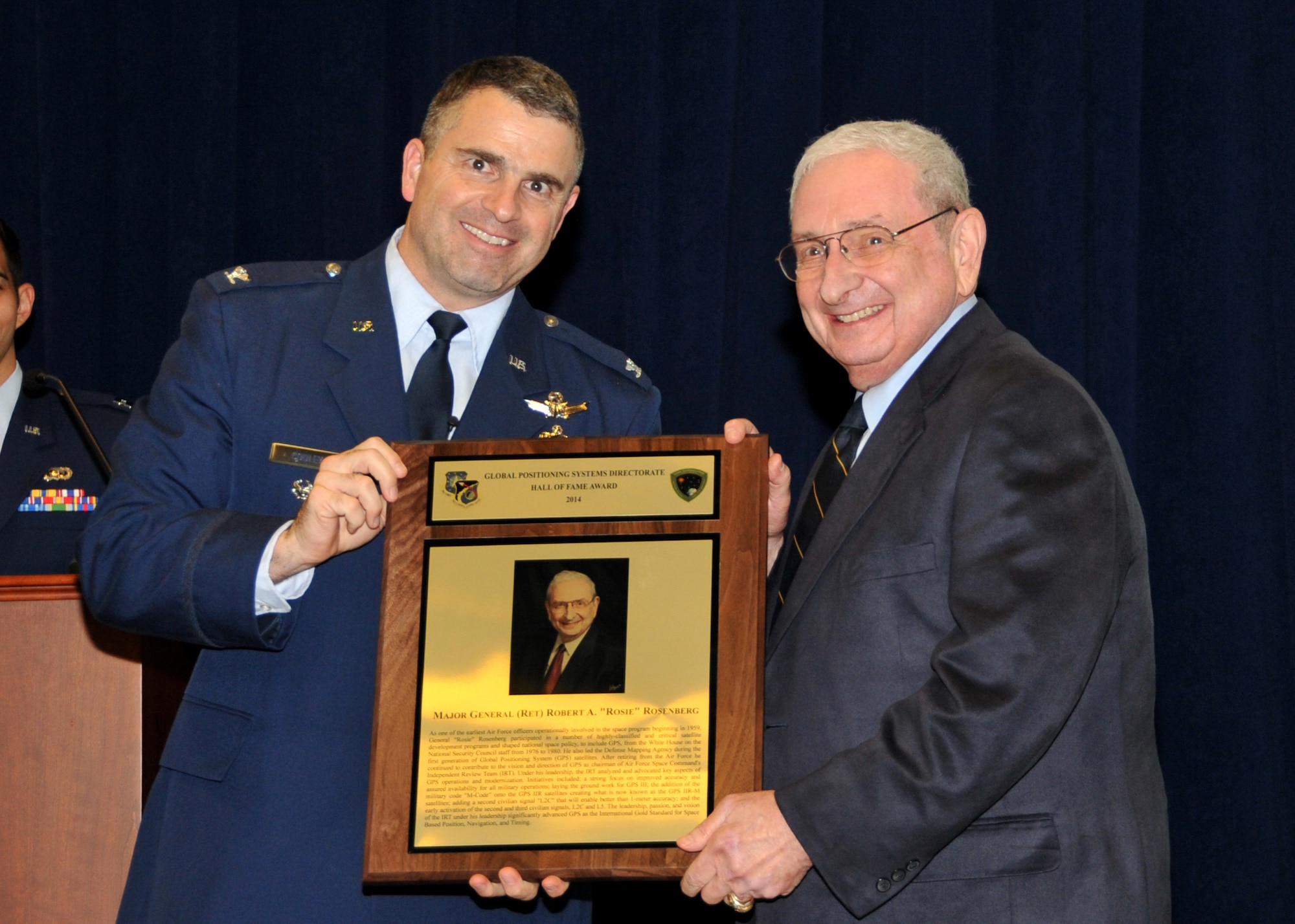 U. S. Air Force Col. William T. Cooley, Director, GPS Directorate hosts the Space and Missile Systems Center 60th Anniversary GPS Heritage Ceremony at Los Angeles Air Force Base in El Segundo, Calif., on August 27, 2014.  The ceremony honors the legacy of GPS systems and recognizing individuals and organizations for space  achievements that represented critical milestones in space development. During the ceremony, the GPS Directorate was presented the 2014 Space Foundation's Space Achievement Award and recognized the 2014 Navstar GPS Hall of Fame recipient, Maj. Gen. (Ret) Robert A. Rosenberg, for his outstanding and distinguished contributions to GPS. Attendees were also treated to a keynote speaker, Dr. Bradford Parkinson. (U.S. Air Force photo by Sarah Corrice)