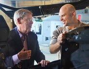 Lt. Col Philip Eilertson, Marine Aircraft Group 49 Detachment A commanding officer, shows Sen. Johnny Isakson the interior of an AH-1W Super Cobra attack helicopter during the senator’s visit to Robins, August 16, 2014. While here, Isakson also visited the 561st Aircraft Maintenance Squadron. (U.S. Air Force photo by Tommie Horton)