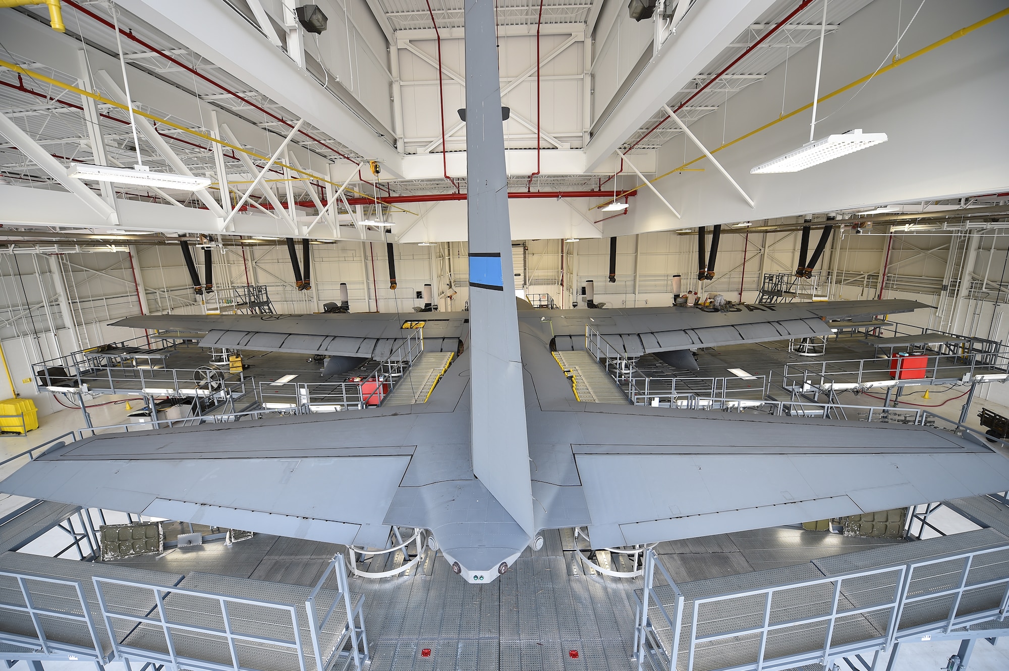 Youngstown Air Reserve Station C-130H Hercules aircraft tail #107 sits in a hangar surrounded by a new isochronal inspection dock stand system here, Aug. 25, as Airmen work atop the aircraft’s wing. Each Youngstown C-130 undergoes an isochronal inspection every 540 days. 910th Maintainers now perform the inspections using a new, $1.5 million dock stand system designed to increase efficiency and safety for workers. YARS is the first installation in Air Force Reserve Command to acquire the system beyond its prototype phase. U.S. Air Force photo/Eric M. White.