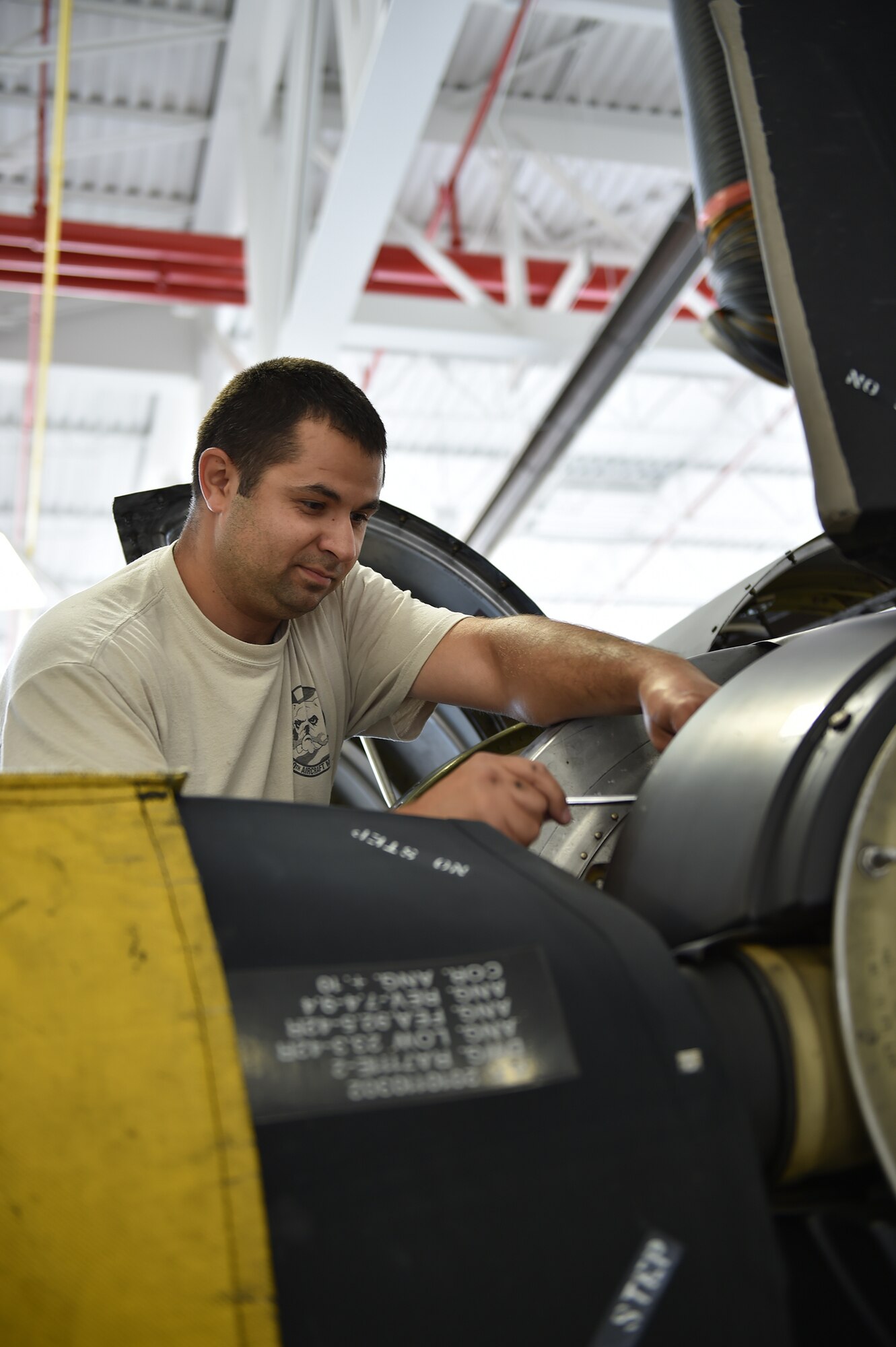 Technical Sgt. Florin Gargarita, an aerospace propulsion craftsman with the 910th Maintenance Squadron, works on a C-130H Hercules aircraft engine during an isochronal inspection here, Aug.25. Each Youngstown C-130 undergoes an isochronal inspection every 540 days. 910th Maintainers now perform the inspections using a new, $1.5 million dock stand system designed to increase efficiency and safety for workers. YARS is the first installation in Air Force Reserve Command to acquire the system beyond its prototype phase. U.S. Air Force photo/Eric M. White.