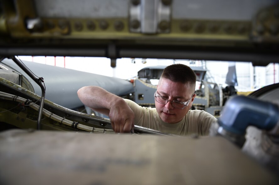 Technical Sgt. Steven Lew, an aerospace propulsion journeyman with the 910th Maintenance Squadron, works on a C-130H Hercules aircraft engine during an isochronal inspection here, Aug.25. Each Youngstown C-130 undergoes an isochronal inspection every 540 days. 910th Maintainers now perform the inspections using a new, $1.5 million dock stand system designed to increase efficiency and safety for workers. YARS is the first installation in Air Force Reserve Command to acquire the system beyond its prototype phase.