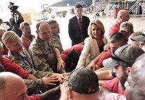 Lt. Col. Jennifer Hammerstedt, 402nd Aircraft Maintenance Group commander; Lt. Gen. Bruce Litchfield, Air Force Sustainment Center commander; Brig. Gen. Walter Lindsley, Warner Robins Air Logistics Complex commander; Secretary of the Air Force Deborah Lee James; and Robbie Tidwell, American Federation of Government Employees Local 987 president; join members of Team Robins Friday in a rallying call at Hangar 47 during the secretary’s visit to the 402nd Aircraft Maintenance Group. (U.S. Air Force photo by Ray Crayton)