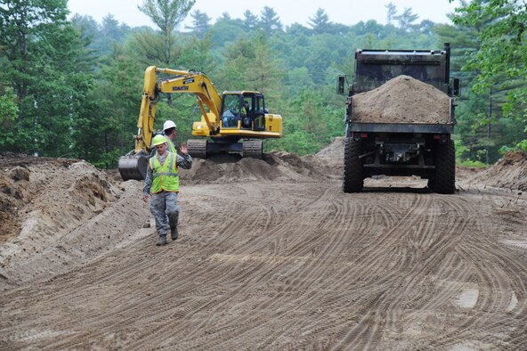Airmen from the Kentucky Air National Guard’s 123rd Civil Engineer Squadron clear the way for a new road at Camp William Hinds Boy Scout camp in Raymond, Maine on June 13, 2014. About 30 members from the 123rd Airlift Wing went to Maine for its annual deployment for training from June 1-15 to help renovate camp facilities for the Boy Scouts of America. (Courtesy Photo) 