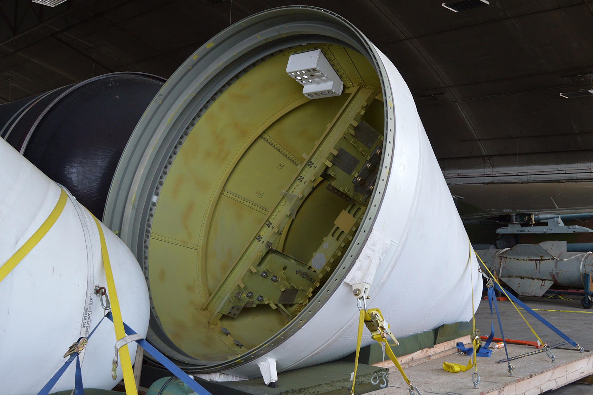 DAYTON, Ohio -- The Titan IVB space launch vehicle in the restoration hangar at the National Museum of the United States Air Force. These are nose cones from the solid rocket motor units. (U.S. Air Force photo)
