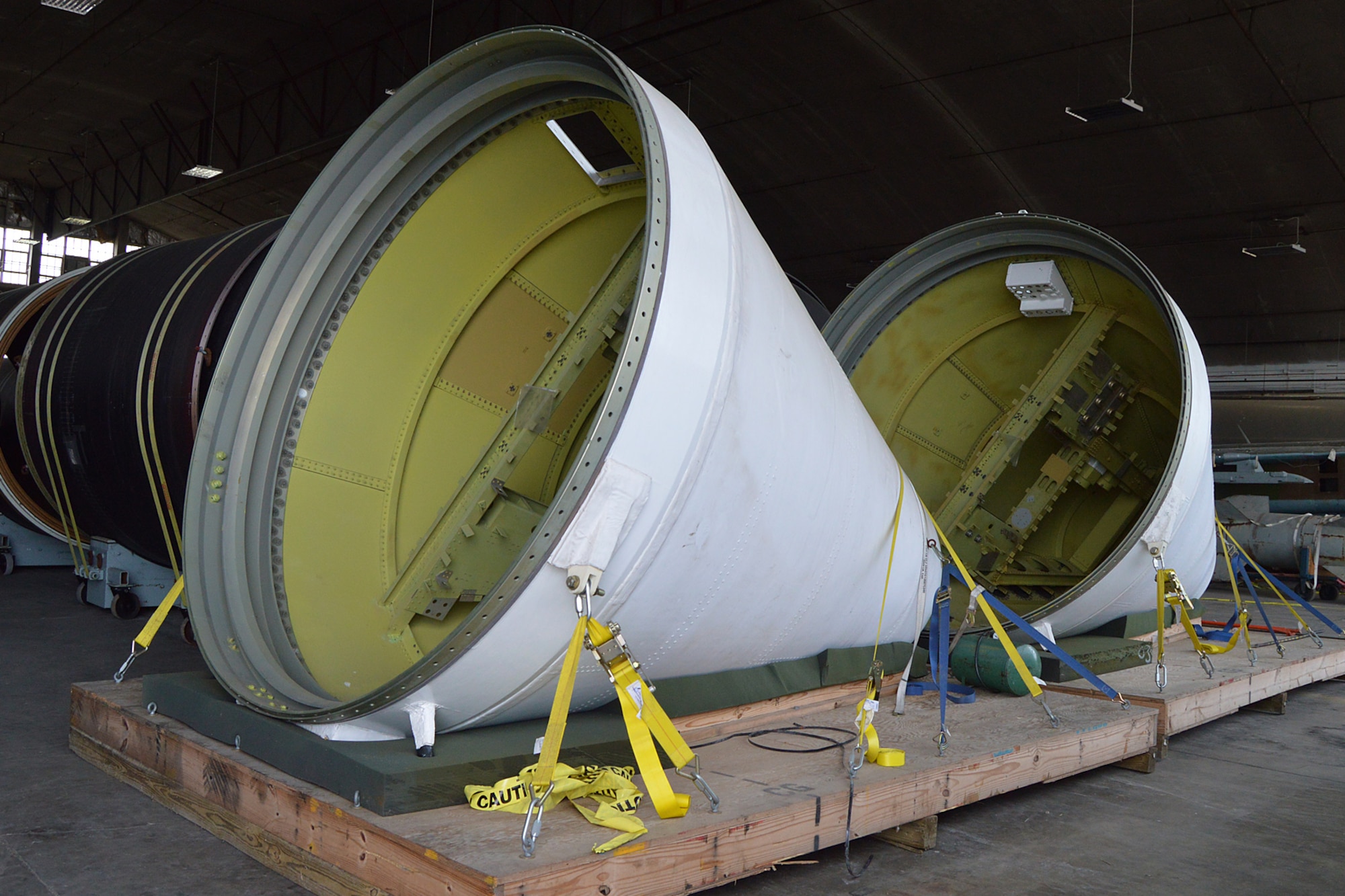 DAYTON, Ohio -- The Titan IVB space launch vehicle in the restoration hangar at the National Museum of the United States Air Force. These are the nose cones from the solid rocket motor units. (U.S. Air Force photo)
