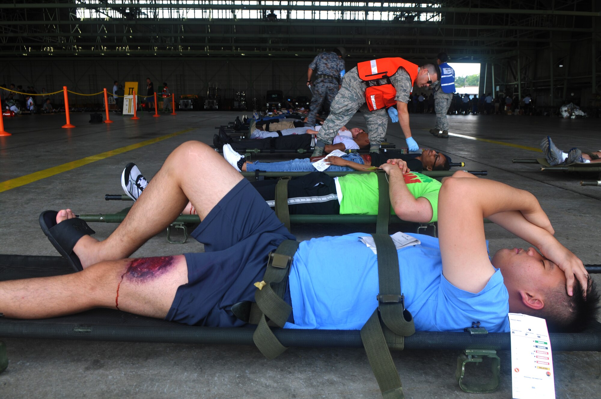 Simulated victims await medical care during a joint bilateral Major Accident Response Exercise at Misawa Air Base, Japan Aug. 22, 2014. The victims’ injuries were identified and priority was given to those with the most severe injuries. (U.S. Air Force photo by Senior Airman Jose L. Hernandez-Domitilo)