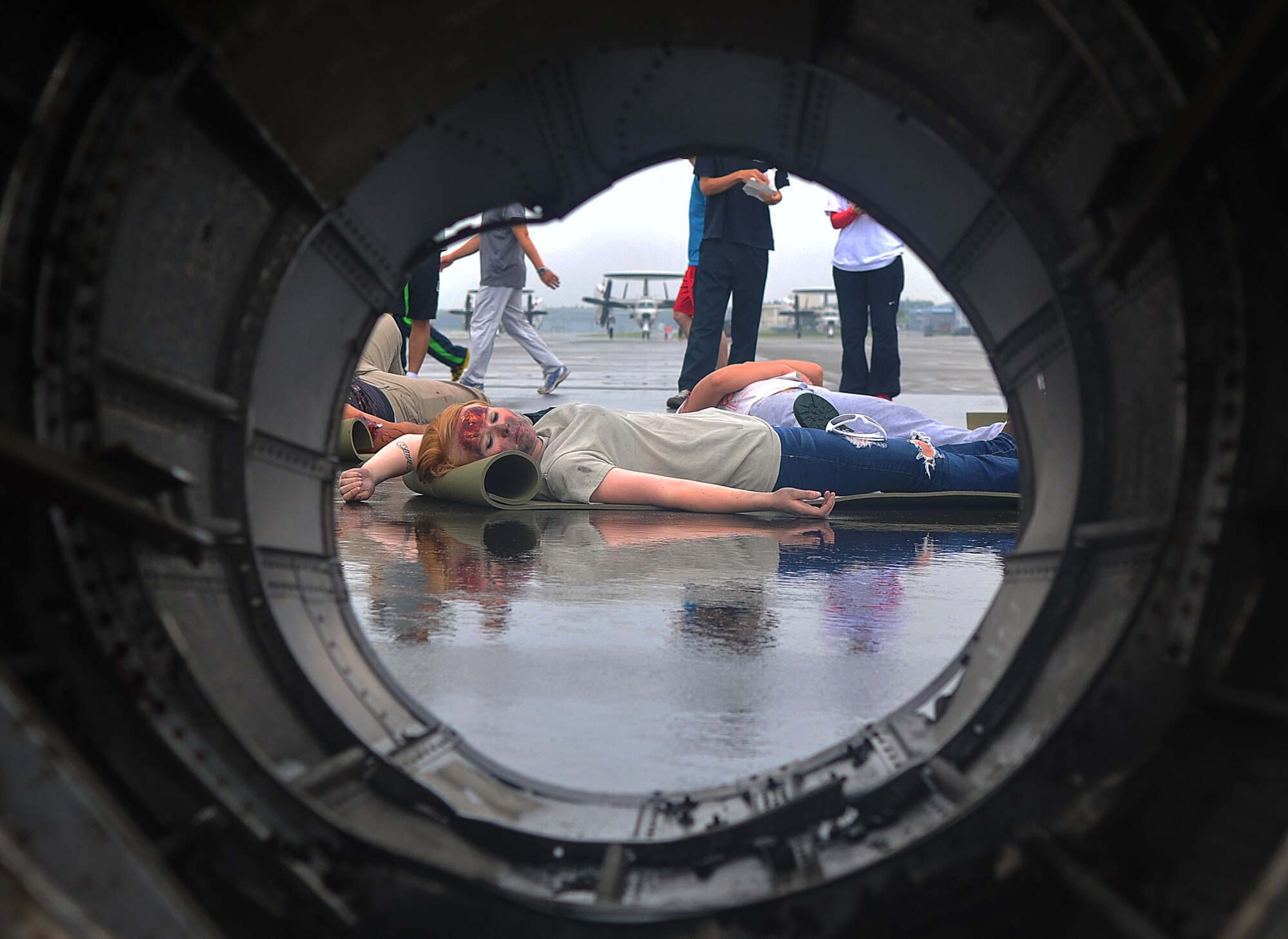 A simulated victim awaits medical assistance during a joint bilateral Major Accident Response Exercise at Misawa Air Base, Japan Aug. 22, 2014. During the exercise, 100 victims simulated a variety of injuries ranging from minor burns to severe intestinal injuries. (U.S. Air Force photo by Senior Airman Jose L. Hernandez-Domitilo)