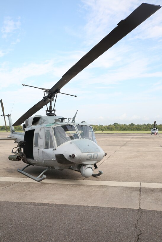 A UH-1N Huey helicopter with Marine Light Attack Helicopter Squadron 773, Marine Aircraft Group 49, is displayed for ceremony attendees to view during a final flight ceremony for the UH-1N Huey helicopter aboard Naval Air Station Joint Reserve Base, New Orleans, Aug. 28, 2014. Over the years the Marine Corps has developed a number of upgrades for the aircraft including improved avionics, aircraft survivability equipment and forward looking infrared sensors. The UH-1N Huey flew its last flight in combat in Afghanistan in 2010, it has been formally replaced by the UH-1Y Venom.