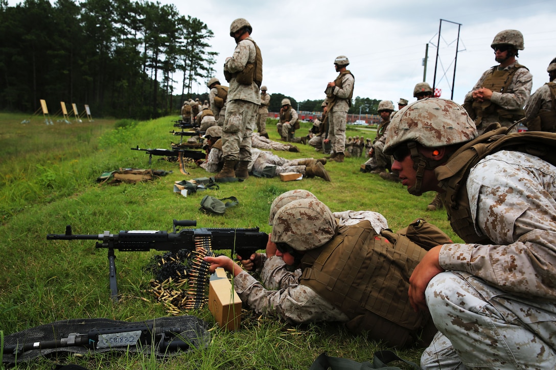 Marines with Marine Air Support Squadron 1 fire the M-240B machine gun during a live fire-range at Marine Corps Base Camp Lejeune, N.C., Aug. 25, 2014. The squadron conducted the training as a refresher for Marines with little or no hands-on experience with crew-served weapons, including the M-240B machine gun.