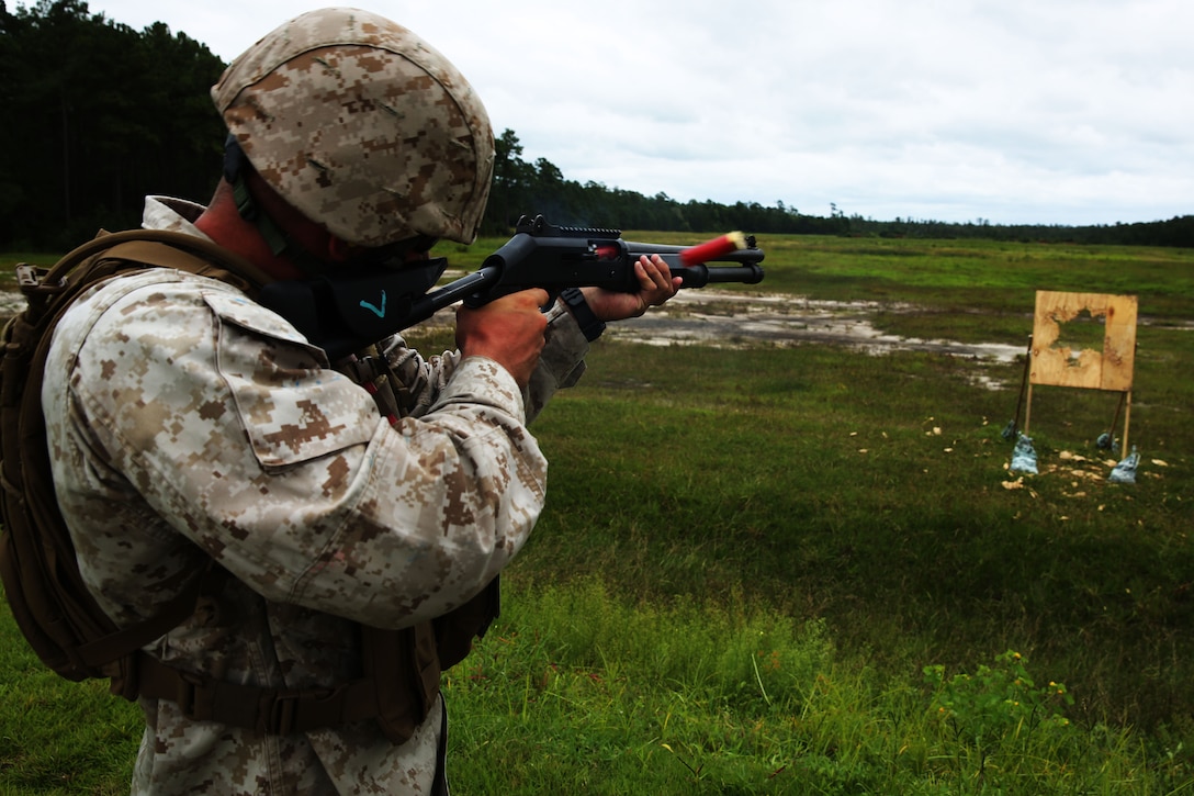 Lance Cpl. Ryan Pippen fires a M-1014 combat shotgun during a live-fire range at Marine Corps Base Camp Lejeune, N.C., Aug. 25, 2014. Pippen is an aviation communications technician with Marine Air Support Squadron 1.