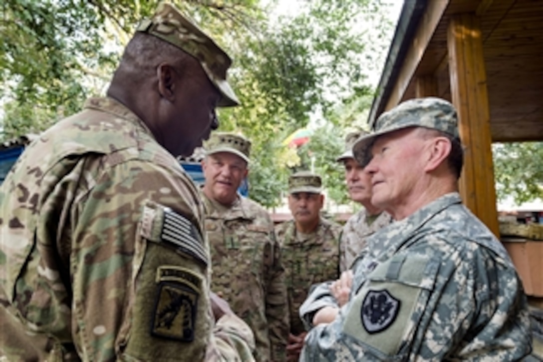 U.S. Army Gen. Martin E. Dempsey, right, chairman of the Joint Chiefs of Staff, talks with U.S. Army Gen. Lloyd J. Austin III; U.S. Air Force Gen. Philip M. Breedlove; U.S. Army Gen. John F. Campbell; and U.S. Marine Corps Gen. Joseph H. Dunford Jr. before NATO's International Security Assistance Force change-of-command ceremony in Kabul, Afghanistan, Aug. 26, 2014. Campbell, former Army vice chief of staff, assumed command from Dunford. 