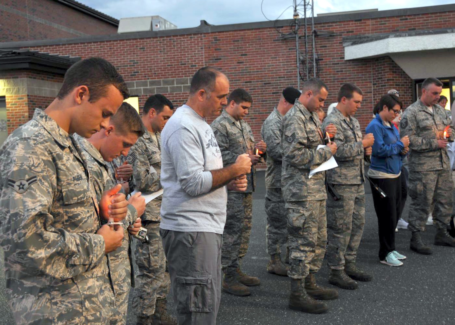 Members of the 104th Fighter Wing keep the family of Lt. Col. Morris Fontenot Jr. in their thoughts and prayers during a vigil Aug. 28, 2014, at Barnes Air National Guard Base, Westfield, Mass.