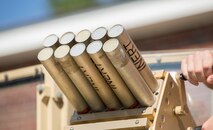 Marines with II Marine Expeditionary Force practice loading and unloading inert rounds into the Non-Lethal, Tube-Launched Munitions System during their practical application training at Camp Lejeune, North Carolina, Aug. 14, 2014. Marine Corps Systems Command Optics and Non-Lethal Systems is fielding the system that sends non-lethal munitions out as far as 500 meters and uses an audible bang to deter a crowd or a person with mal-intent. Its intended use is for military checkpoints. 
