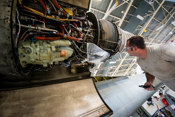 Staff Sgt. Michael Griggs checks his work on a strut safety wire in an A-10C Thunderbolt II at Moody Air Force Base, Ga., Aug.12, 2014. Griggs is an aerospace propulsion craftsman with the 23rd Component Maintenance Squadron. Aircraft are sent to the phase hangar every 500 and 1,000 hours for in-depth inspections. (U.S. Air Force photo/Airman 1st Class Ryan Callaghan)