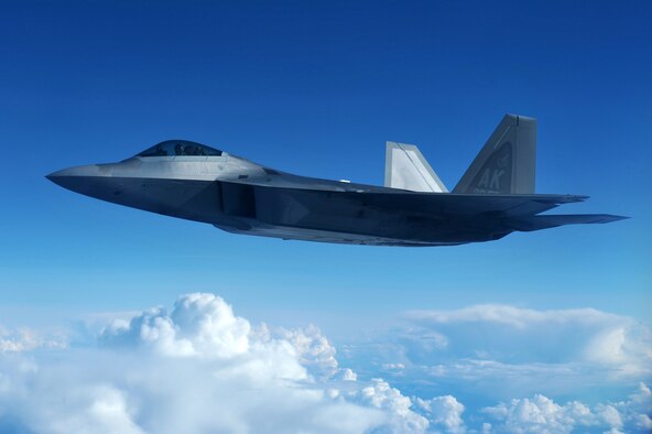 A U.S. Air Force F-22 Raptor flies over clouds during RED FLAG-Alaska 14-3 Aug. 20, 2014, at Eielson Air Force Base, Alaska. The F-22, assigned to the 90th Fighter Squadron, Joint Base Elmendorf-Richardson, Alaska, possesses a sophisticated sensor suite allowing the pilot to track, identify, shoot and kill air-to-air threats before being detected. (U.S. Air Force photo/Staff Sgt. Jim Araos)