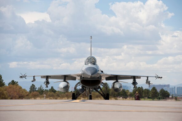 An F-16 Fighting Falcon from the 309th Fighter Squadron, Luke Air Force Base, Ariz., taxis to the runway during Green Flag-West 14-09 at Nellis AFB, Nev., Aug. 21, 2014. Green Flag exercises give visiting units the opportunity to train in air-to-ground combat operations. Many of the training exercise scenarios call for providing air support to ground troops who are participating in ground combat exercises. (U.S. Air Force photo /Airman 1st Class Thomas Spangler)