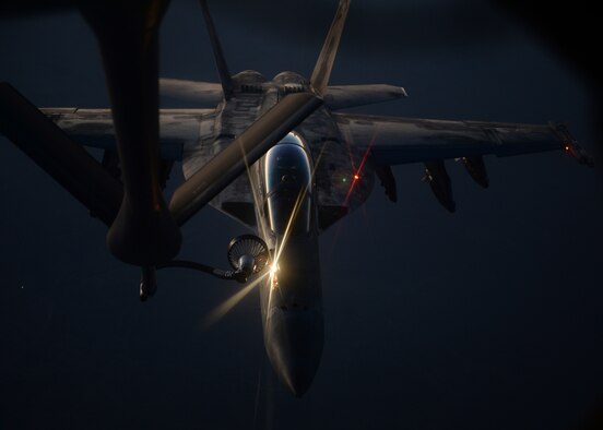 An U.S. fighter jet refuels from an Air Force KC-135 Stratotanker Aug. 21. (U.S. AirForce photo/Staff Sgt. Shawn  Nickel)