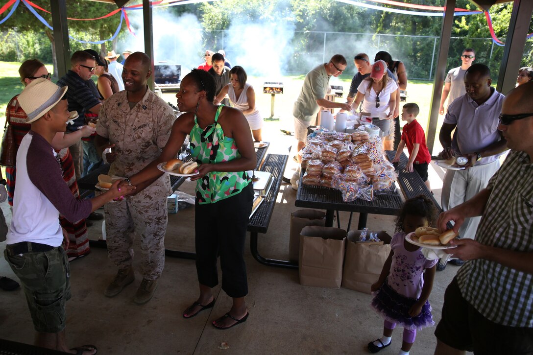 Families from the Marine Corps Recruiting Command gather to eat during the 2014 MCRC Family Day. Marines, sailors and civilian Marines brought food and homemade goods for everyone to enjoy before participating in numerous recreational activities with their families during the event, here, Aug. 28.
