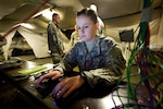Pfc. Hannah Quaney of the Colorado Army National Guard operates a network computer that facilitates her battalion's automation system during a computer simulated training exercise in Postojna, Slovenia. Immediate Response 14 is a U.S. Army Europe-sponsored exercise hosted by Slovenia this year. IR14 is designed to prepare participating nations for increased contributions to ongoing and future NATO post ISAF operations, while enhancing regional cooperation, confidence, and security assurance among regional Balkan allies.