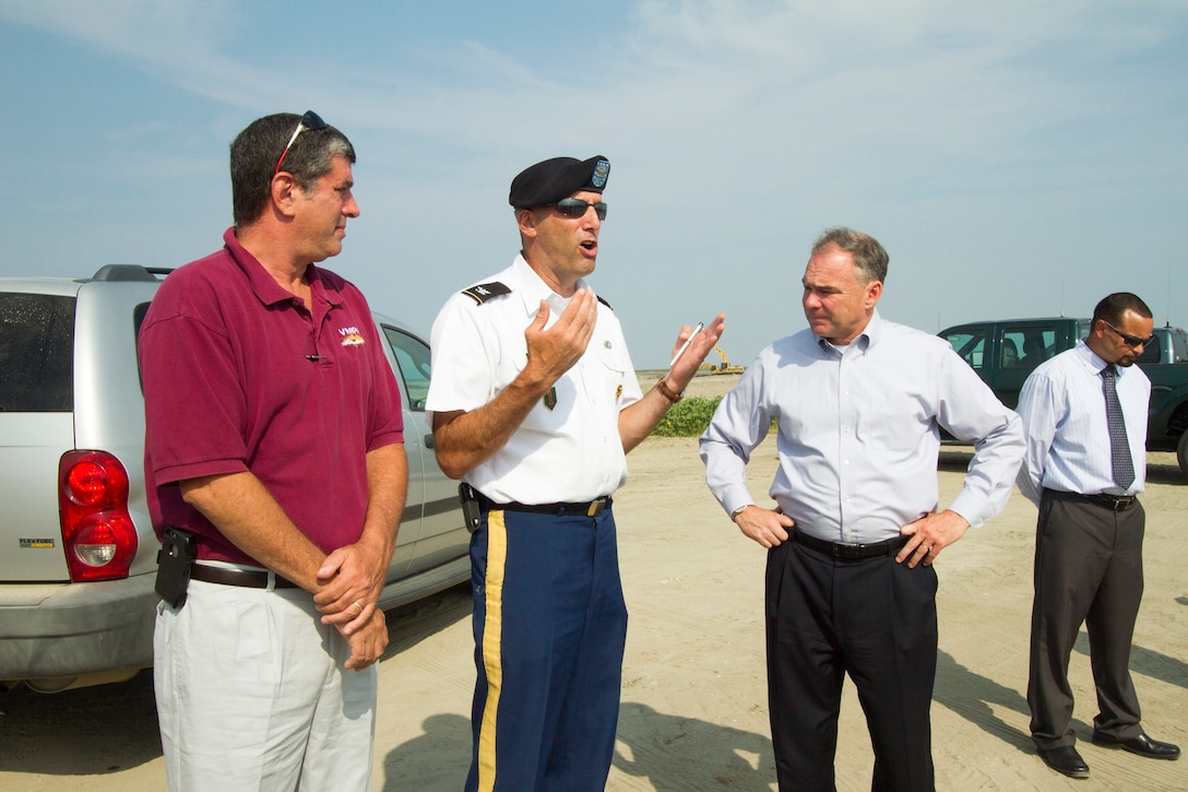 NORFOLK, Va. – Col. Paul Olsen, Norfolk District commander, talks with Sen. Tim Kaine (right) and John Bull, commissioner of the Virginia Marine Resources Commission, about the Norfolk District’s Craney Island Dredged Material Management Area Aug. 28, 2014.  Officials with the Virginia Port Authority, the Virginia Pilots Association and the Virginia Marine Resources Commission also briefed the senator on oyster restoration efforts, the federal navigation channel and other port issues during his visit. (U.S. Army photo/Patrick Bloodgood)