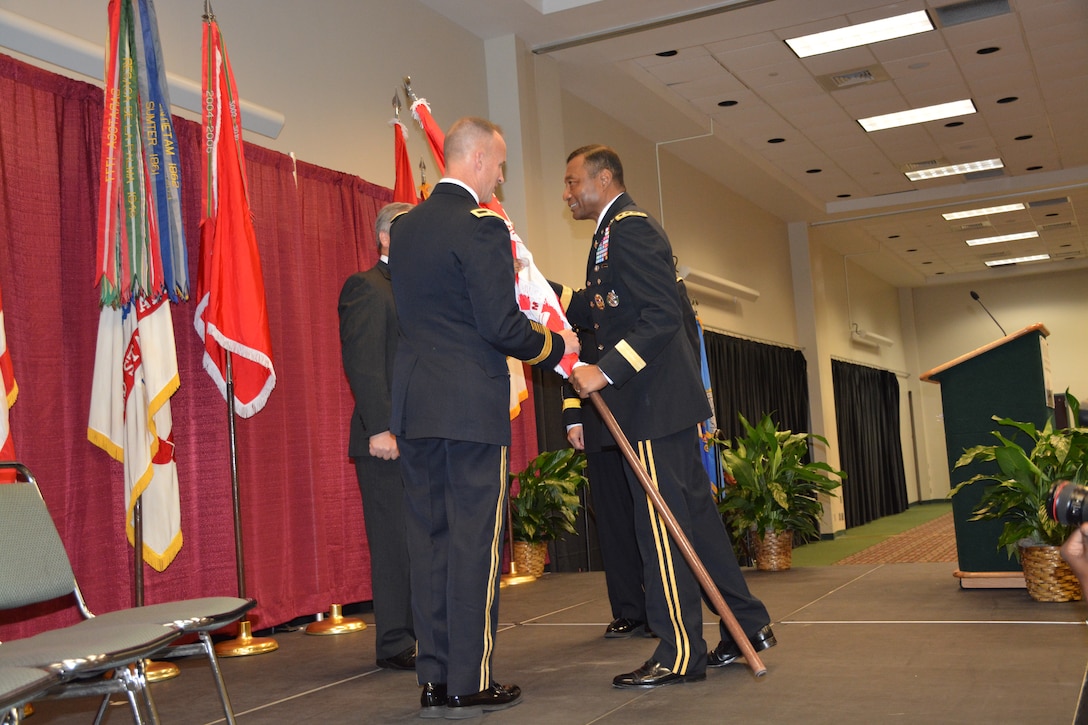 Chief of Engineers Lt. Gen. Thomas Bostick passed the flag to new MVD Commander Brig. Gen. (P) Michael C. Wehr during a Change of Command Ceremony Aug. 29, 2014, in the Vicksburg Convention Center. Wehr is the division’s 38th commander. (Photo by Pamela Harrion, MVD PAO)