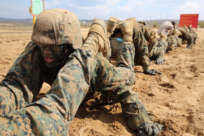 Pvt. Joel A. Lopez, Platoon 3263, Mike Company, 3rd Recruit Training Battalion, performs buddy push-ups with his platoon during the Crucible at Marine Corps Base
Camp Pendleton, Calif., Aug. 20. Lopez graduates recruit training today, and will then attend Marine Combat Training at Camp Pendleton. Upon completion of MCT, he will
continue training for his military occupational specialty as a field artillery cannoneer.