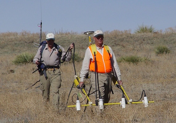 Using the metal detectors of the day, USACE contractors in 2005, look for munitions at the former Lowry Bombing and Gunnery range near Denver, Colo.