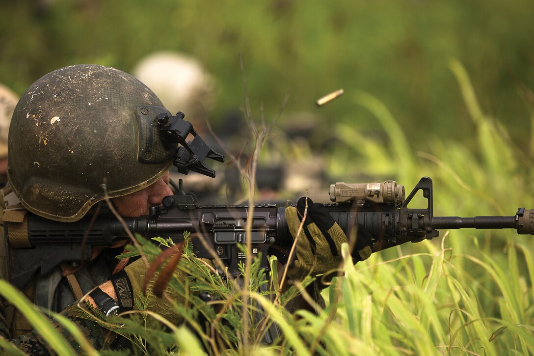 MARINE CORPS BASE HAWAII - Marines with reserve 4th Force Reconnaissance Company conduct live-fire training during their full-mission profile as part of their annual training on and around Kaneohe Bay Range Training Facility, Aug. 23, 2014. Force Recon’s mission is conducting deep reconnaissance to provide intelligence to follow-on forces. (U.S. Marine Corps photo by Cpl. Matthew Callahan)