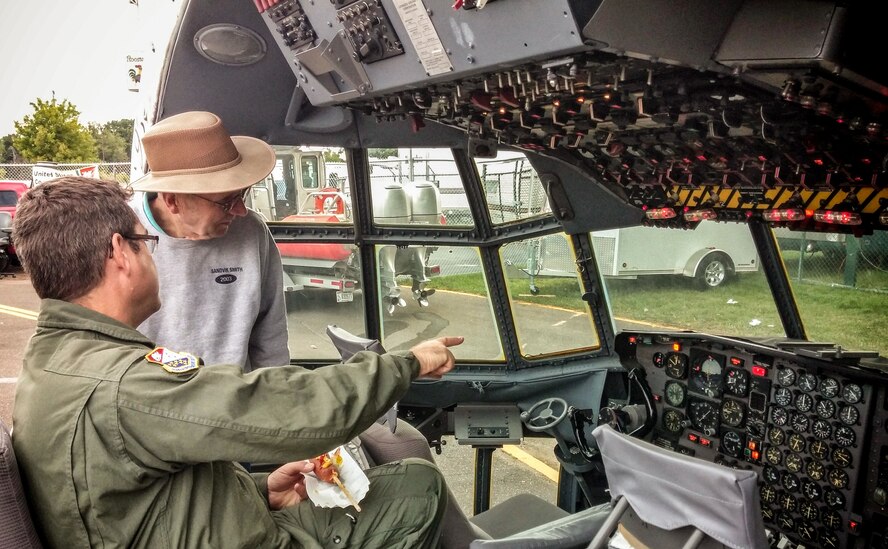 Master Sgt. James Courneya, 934th Operations Group loadmaster, shows off the 934th Airlift Wing flight deck display at the Minnesota State Fair during military appreciation day August 26. (U.S. Air Force photo/Shannon McKay)