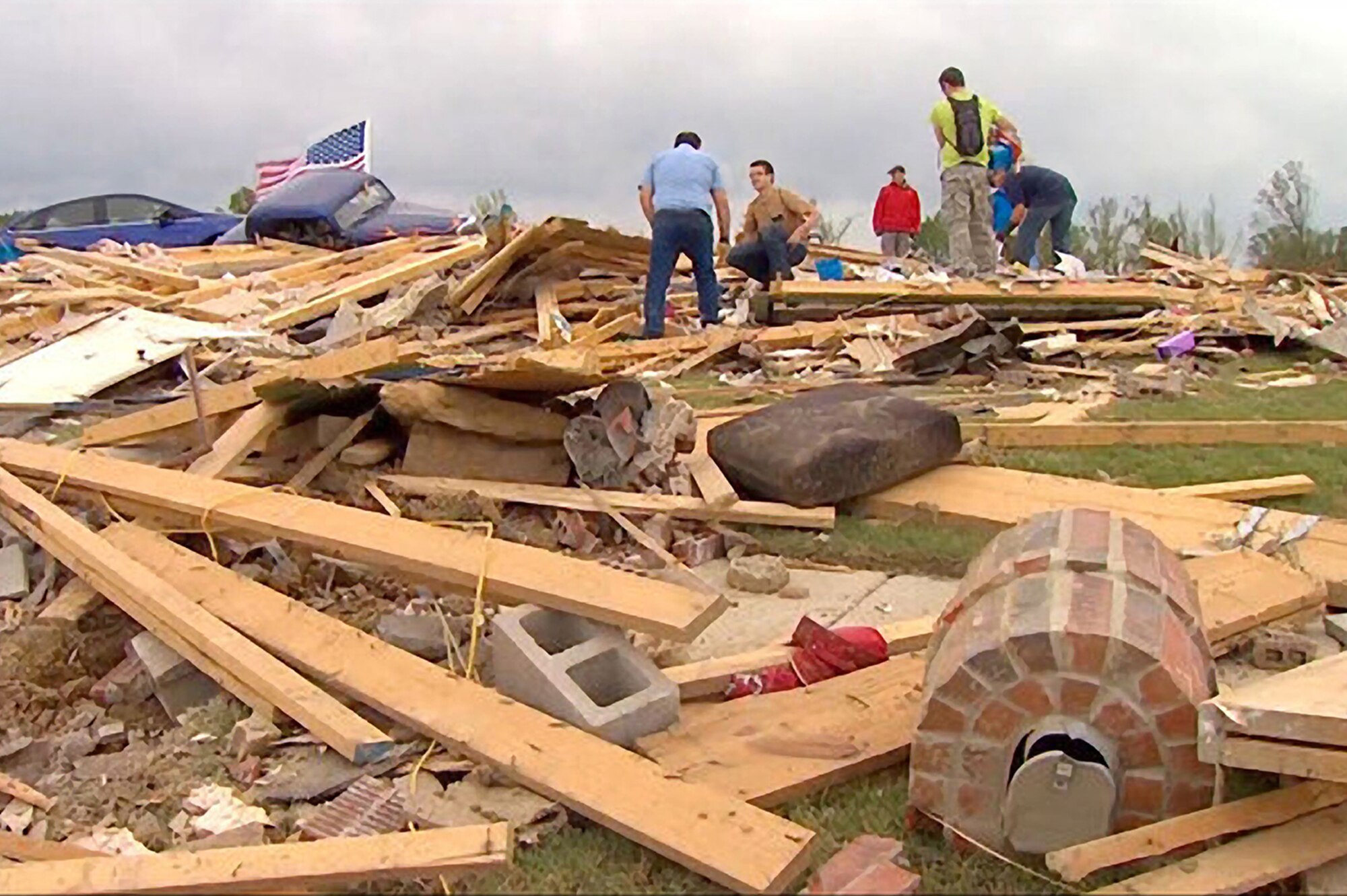 Sifting through the rubble, locals were devastated by the EF-4 tornado that ripped through the small town of Vilonia. The twister destroyed 50 of the 56 homes in the Wassom’s subdivision and took the lives of 16 people. Among the things recovered in the debris were the Wassom’s beloved cat and two dogs — one of which turned up a month later. All three pets miraculously survived. (Courtesy photo)