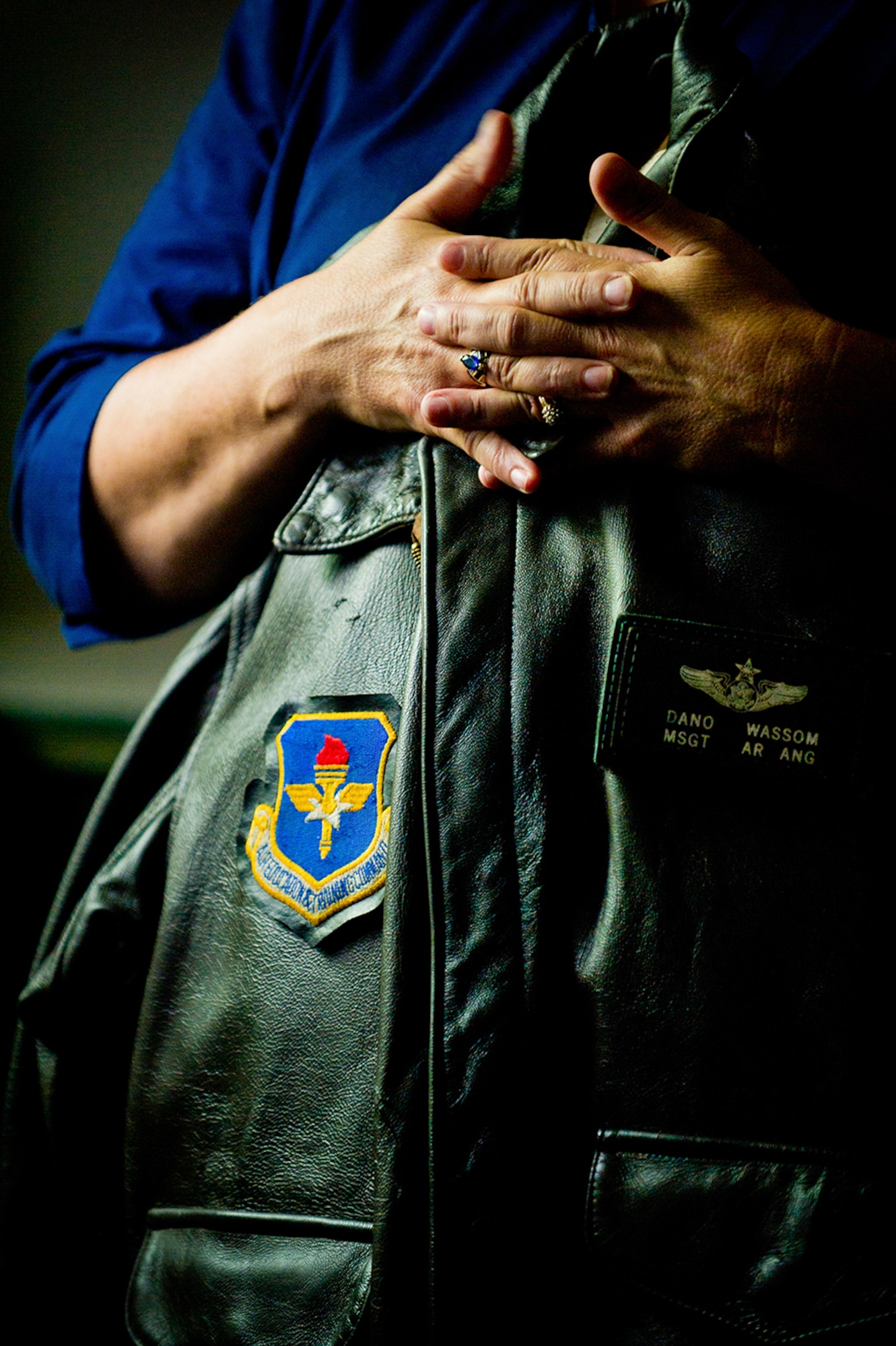 Pamela Wassom, mother of Master Sgt. Daniel R. Wassom II, holds her son’s flight jacket recovered from Master Sgt. Wassom’s destroyed home. (U.S. Air Force photo by Tech. Sgt. Sarayuth Pinthong/ Released)