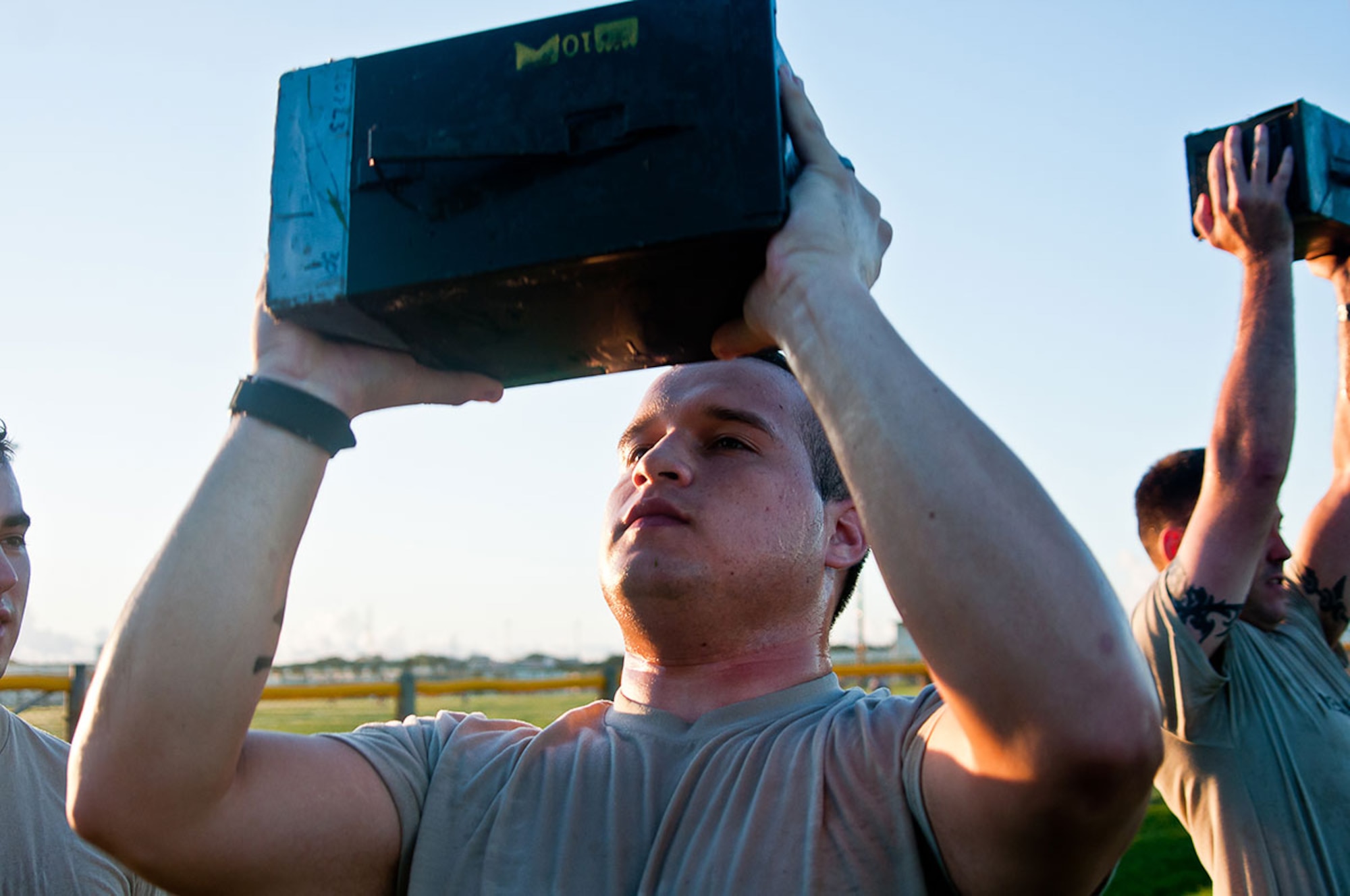 Pfc. James Webb, a human intelligence analyst for the 4th Infantry Brigade Combat Team (Airborne), 25th Infantry Division, lifts a 30-pound ammunition can overhead from shoulder height repeatedly for two minutes as part of the U.S. Marine Corps' Combat Fitness Test at Camp Hansen, Okinawa, Japan Aug. 22, 2014. Elements of the Spartan Brigade are in Okinawa to participate in Exercise Ulchi-Freedom Guardian 2014, a joint/combined command post exercise designed to enhance the Republic of South Korea's defensive capabilities in the face of an aggressor threat. (U.S. Army photo by Sgt. Eric-James Estrada/Released)