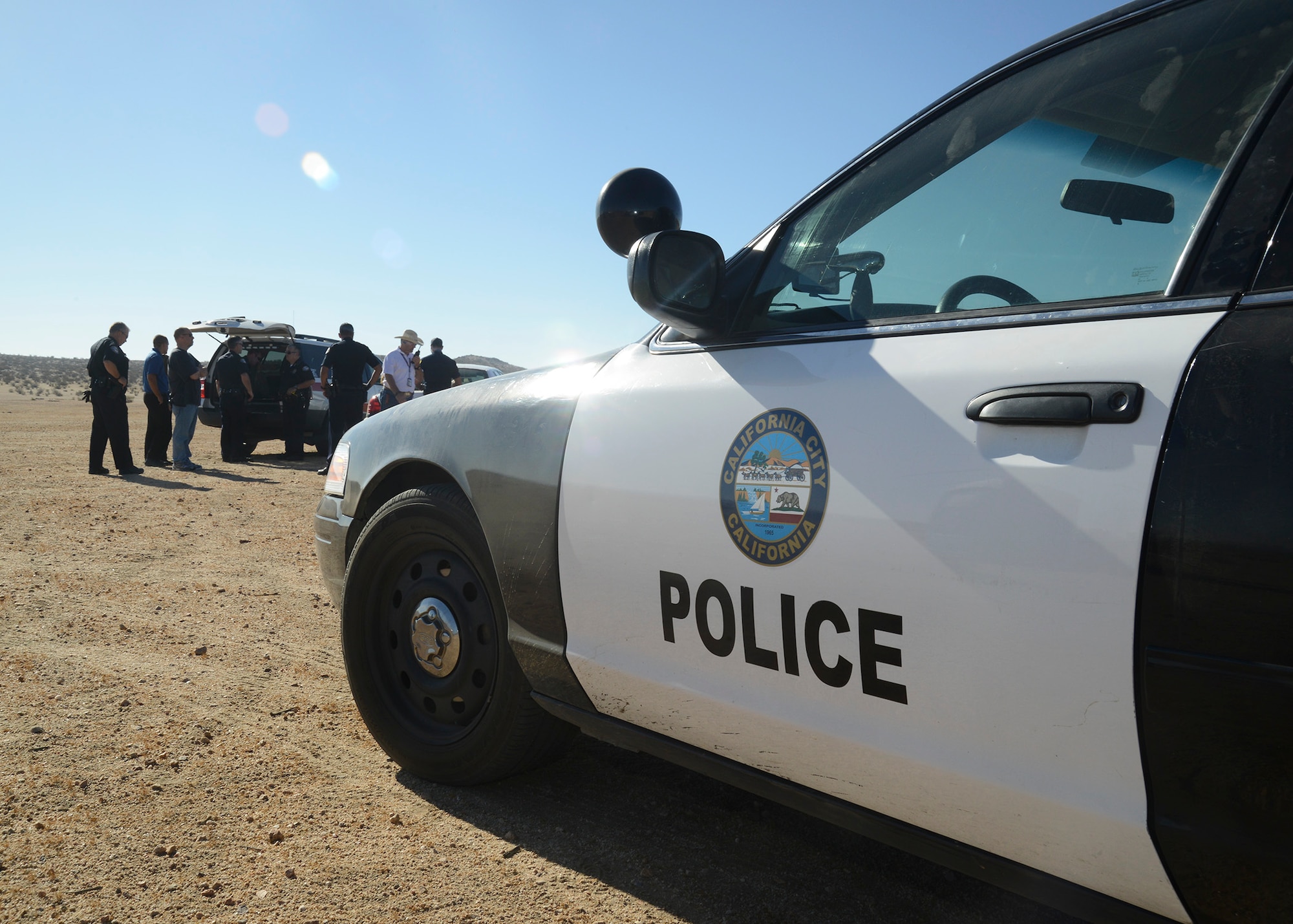 Edwards AFB exercise planners teamed with the California City Police and Cal City Fire Departments to coordinate first response actions for Desert Wind 14-06. The scenario for the emergency response exercise was a mid-air collision between an Edwards F-16 and F-15, resulting in the crash of the F-16. In real life, if a crash occurred off Edwards land, local authorities would be the first to respond. The Cal City departments were also being graded by their respective evaluators. (U.S. Air Force photo by Kenji Thuloweit) 