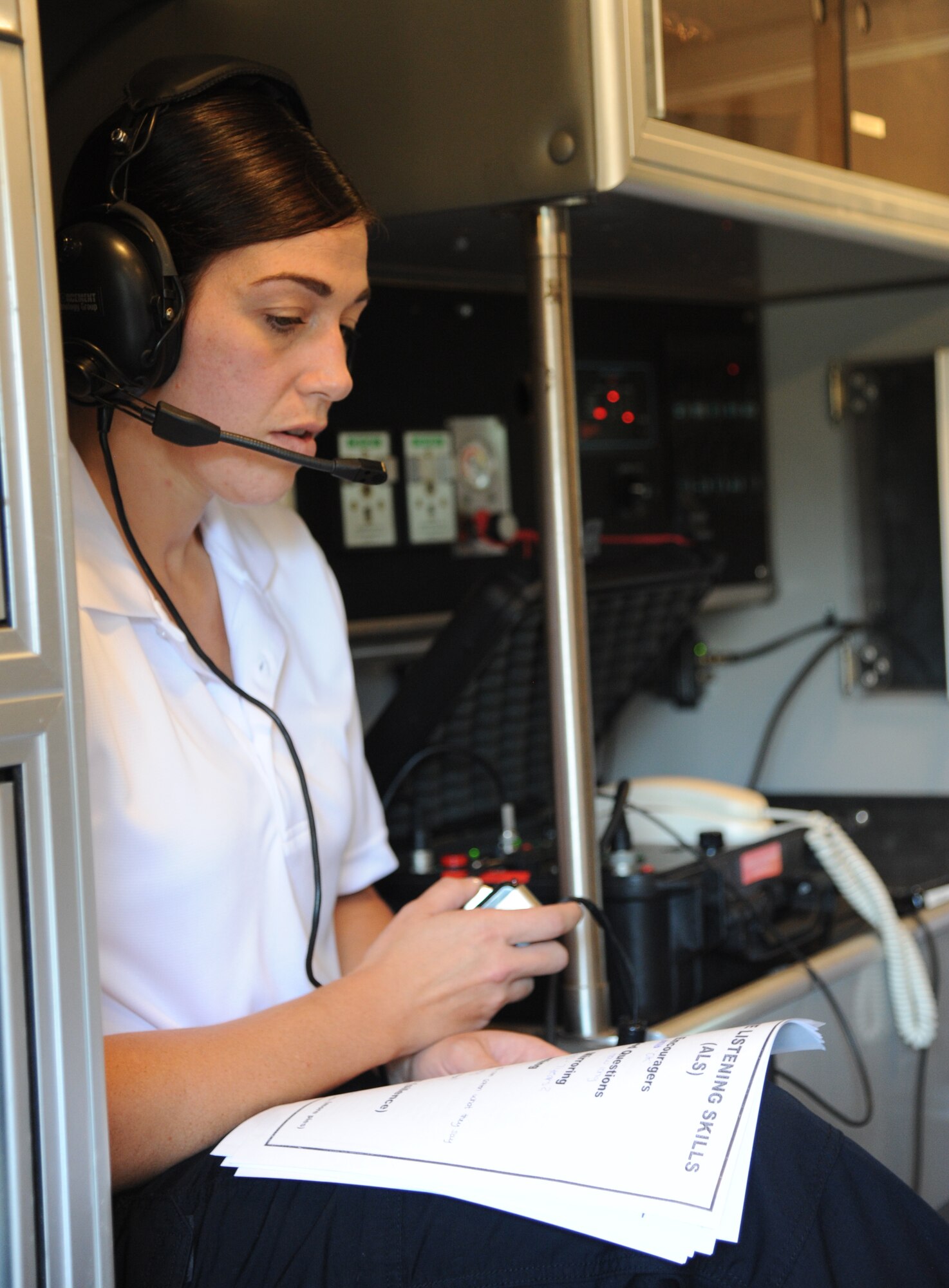 Staff Sgt. Carrie Haroulakis, 81st Security Forces Squadron, attempts to negotiate with a “bad guy” during an FBI crisis negotiations course Aug. 28, 2014, at Keesler Air Force Base, Miss.  The purpose of the course was to train 81st SFS and local law enforcement agencies to handle a myriad of situations they might encounter on the job. The course is dedicated to resolving hostage, barricade, attempted suicide and kidnapping cases throughout their jurisdiction. (U.S. Air Force photo by Kemberly Groue)