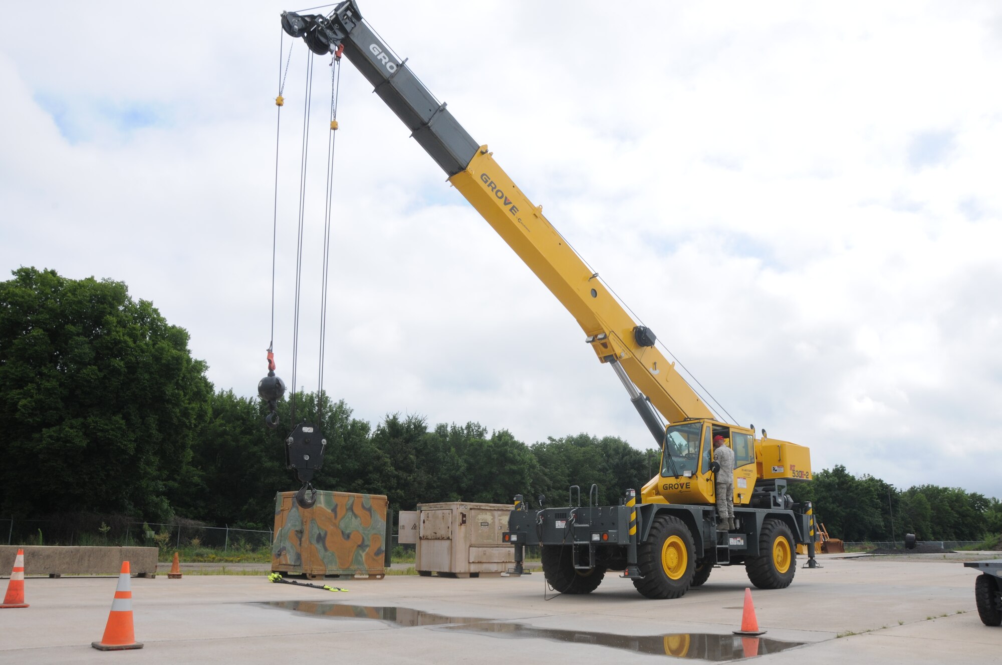Lt. Col. Tenise Gardner, 188th Mission Support Group commander, operates the Grove 30-ton rough terrain mobile crane while Master Sgt. Robert Haag directs her at Ebbing Air National Guard Base, Fort Smith, Arkansas. The crane’s capabilities were showcased during a tour of the 188th Civil Engineering Squadron Rapid Engineer Deployable Heavy Operational Repair Squadron Engineer (REDHORSE) Training Center. The 188th Wing has the Air National Guard’s first and only REDHORSE training center. (U.S. Air National Guard photo by Airman 1st Class Cody Martin/released)