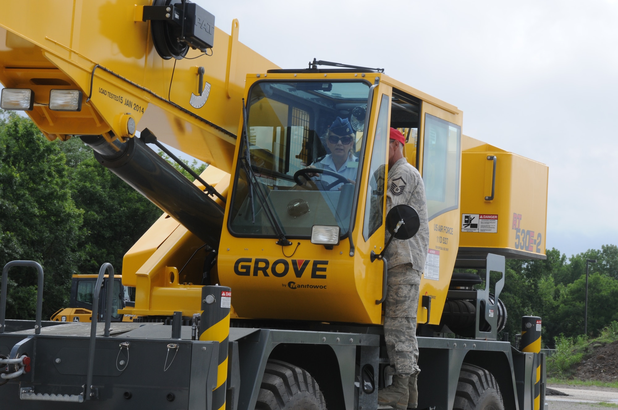 Lt. Col. Tenise Gardner, 188th Mission Support Group commander, operates the Grove 30-ton rough terrain mobile crane while Master Sgt. Robert Haag directs her at Ebbing Air National Guard Base, Fort Smith, Arkansas. The crane’s capabilities were showcased during a tour of the 188th Civil Engineering Squadron Rapid Engineer Deployable Heavy Operational Repair Squadron Engineer (REDHORSE) Training Center. The 188th Wing has the Air National Guard’s first and only REDHORSE training center. (U.S. Air National Guard photo by Airman 1st Class Cody Martin/released)