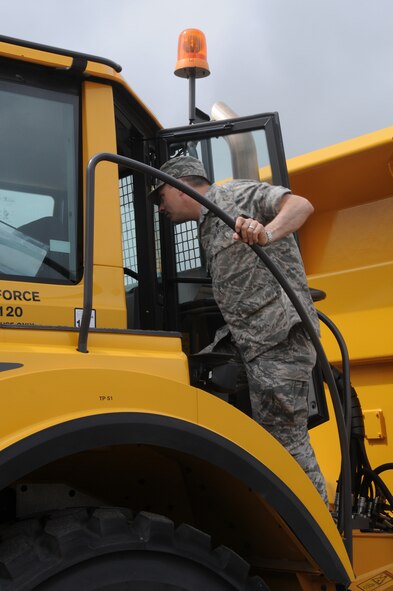 Lt. Col. Deane Thomey, 188th Logistics Readiness Squadron commander, looks inside the cab of a Volvo 25-ton rock dump truck at Ebbing Air National Guard Base, Fort Smith, Arkansas. The vehicle’s capabilities were showcased during a tour of the 188th Civil Engineering Squadron Rapid Engineer Deployable Heavy Operational Repair Squadron Engineer (REDHORSE) Training Center. The 188th Wing has the Air National Guard’s first and only REDHORSE training center. (U.S. Air National Guard photo by Airman 1st Class Cody Martin/released) 
