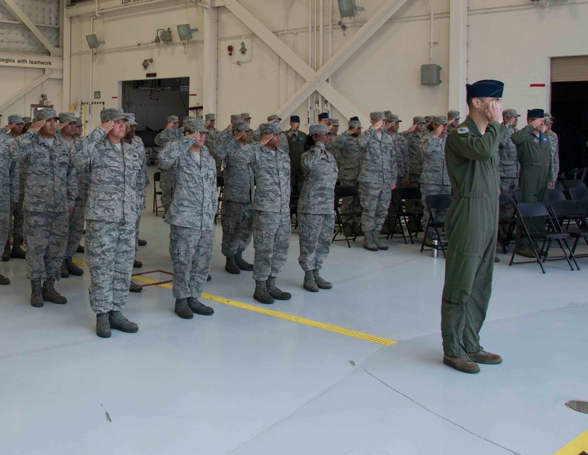 Members from Detachment 93, 495th Fighter Group salute their new commander at the change of command ceremony at Homestead Air Reserve Base, Fla., 28 Aug. Lt. Col. Scott W. Walker relinquished command of Det. 93 to Lt. Col. Henry R. Jeffress. (Air Force photo/Senior Airman Aja Heiden)