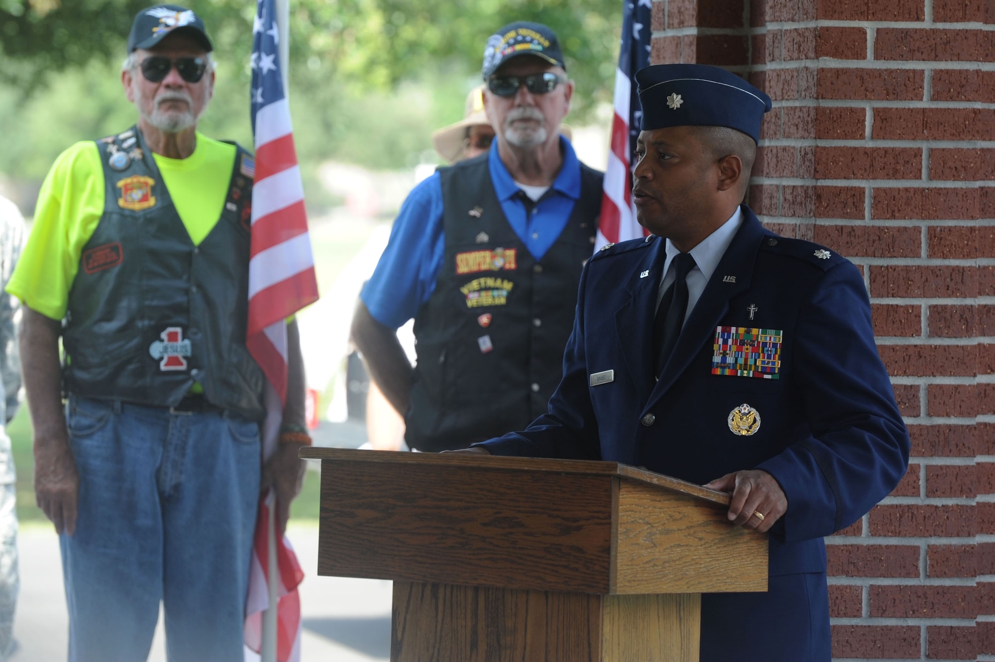 Lt. Col. Steven T. Dabbs, 81st Training Wing deputy wing chaplain, leads a Forgotten Hero ceremony for Maj. Pierre David Junod Aug. 28, 2014, at Biloxi National Cemetery. Keesler personnel, members of the American Patriot Riders, and parishioners of the Nourishing Place chapel attended the ceremony to honor Junod, who had no remaining family. Junod was a U.S. Air Force navigator during the Vietnam War.  (U.S. Air Force photo by Airman 1st Class Stephan Coleman)