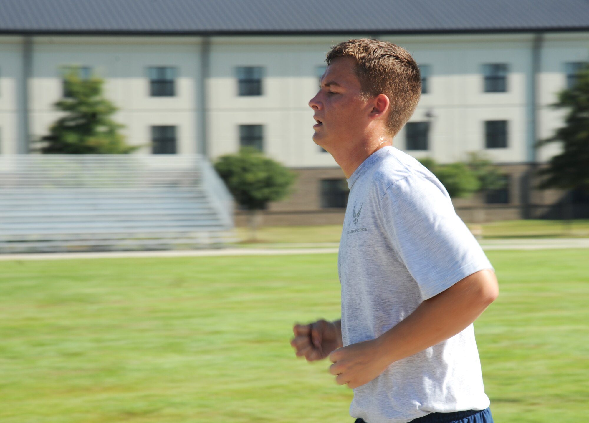 Airman Basic Dylan Breese, 338th Training Squadron, runs laps during a physical training session Aug. 27, 2014, in the triangle area, Keesler Air Force Base, Miss.  Physical training is a top priority for Airmen to be prepared and equipped for any physical challenge they may face when conducting the mission at home station or in a deployed environment. (U.S. Air Force photo by Kemberly Groue)