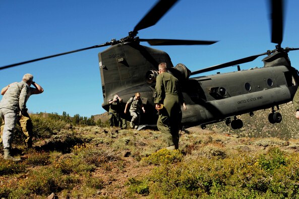 Nevada Air National Guard aircrew members participate in a refresher course on combat survival on August 16, 2014. Over 45 airmen were transported by two Nevada Army National Guard CH-47 Chinooks from the base in Reno, Nev. to the Toiyabe National Forest, near the Marine Corps' Mountain Warfare Training Center located in Pickle Meadows, Calif. (NV ANG Photo by Master Sgt. Suzanne Connell RELEASED)
