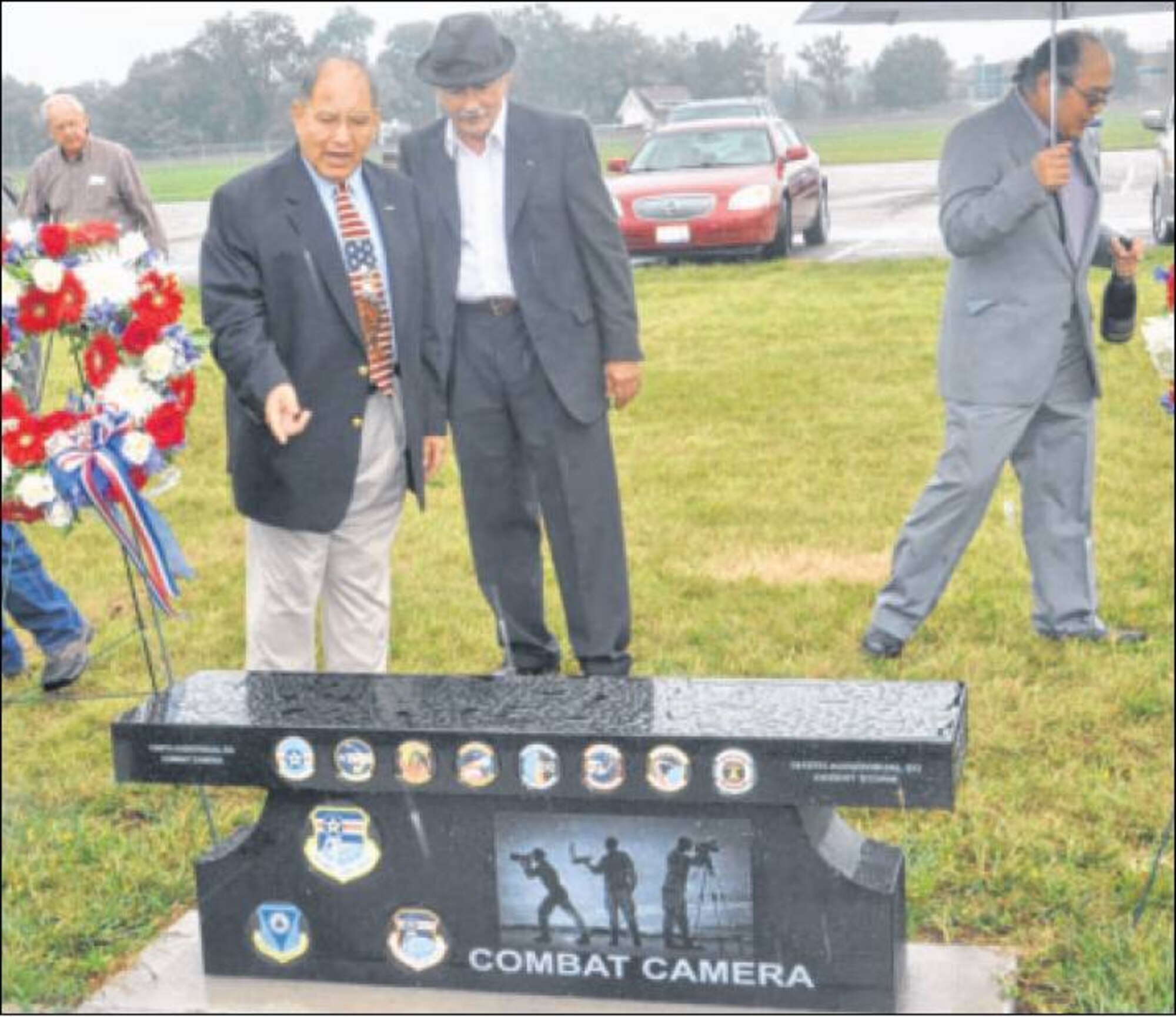 The work of military combat camera service members now has a permanent reminder of their decades-long contributions to the Air Force mission, in the shape of a black granite bench dedicated in the memorial park at the National Museum of The U.S. Air Force. (Air Force photo by Diane Kofoed)