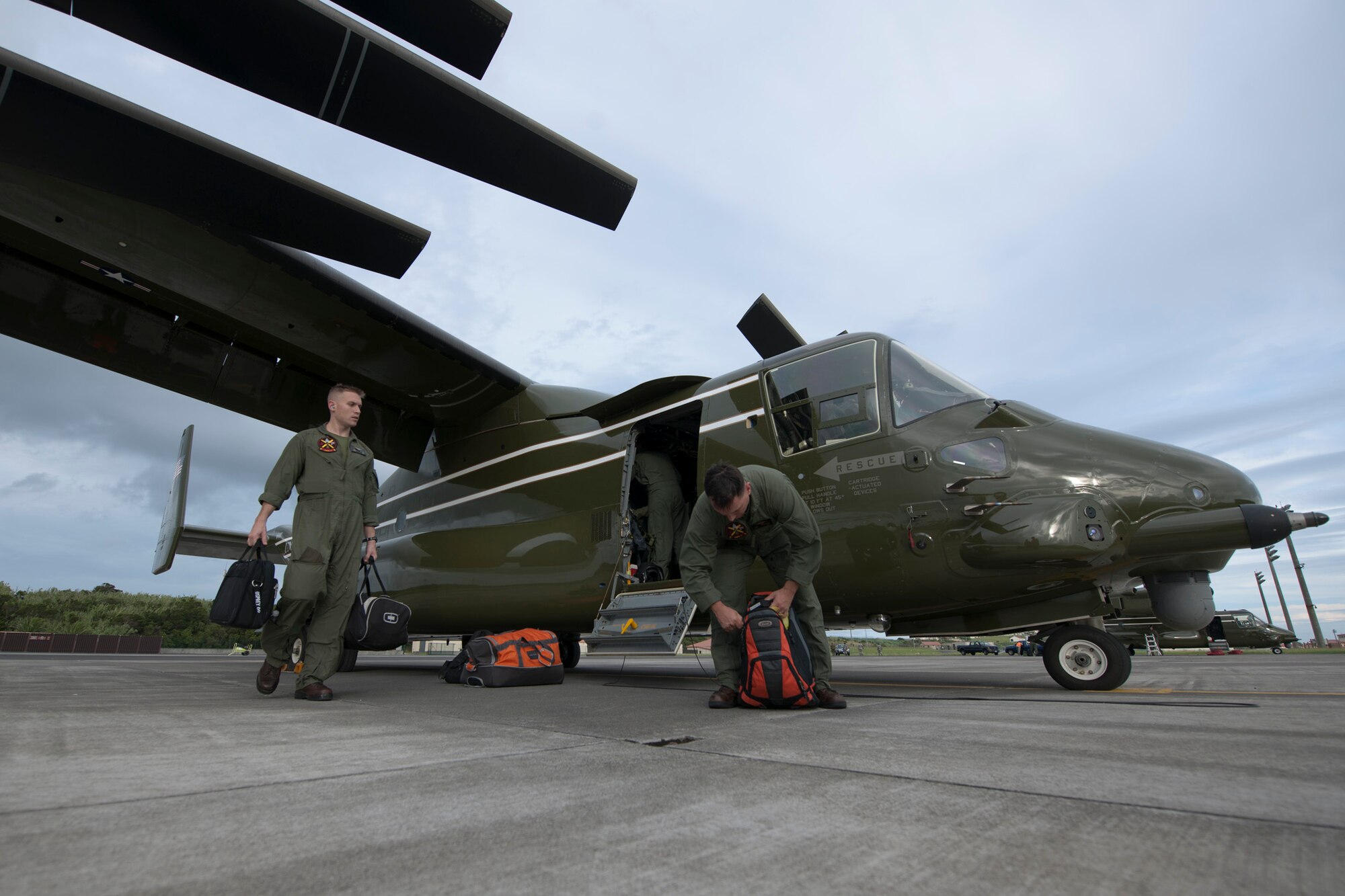 U.S. Marine Corps MV-22B Osprey flight crew gather their luggage after arriving Aug. 26, 2014, Lajes Field, Azores, Portugal. The Marines are assigned to Marine Helicopter Squadron One, Marine Corps Base Quantico, Va. Marines assigned to HMX-1 provide Presidential and VIP support in addition to their primary role as the Operational Test and Evaluation unit for Marine assault support helicopters and related equipment. (U.S. Air Force Photo by Tech. Sgt. Paul Villanueva II/Released)