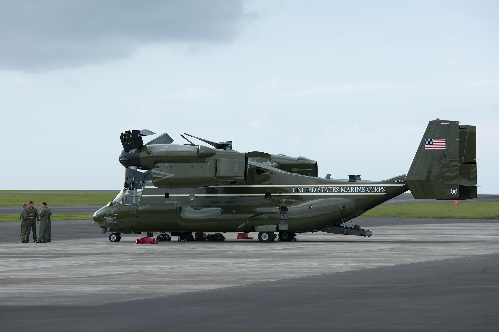 U.S. Marine Corps MV-22B Osprey flight crew have a post flight brief after arriving Aug. 26, 2014, Lajes Field, Azores, Portugal. The Marines are assigned to Marine Helicopter Squadron One, Marine Corps Base Quantico, Va. Marines assigned to HMX-1 provide Presidential and VIP support in addition to their primary role as the Operational Test and Evaluation unit for Marine assault support helicopters and related equipment. (U.S. Air Force Photo by Tech. Sgt. Paul Villanueva II/Released)