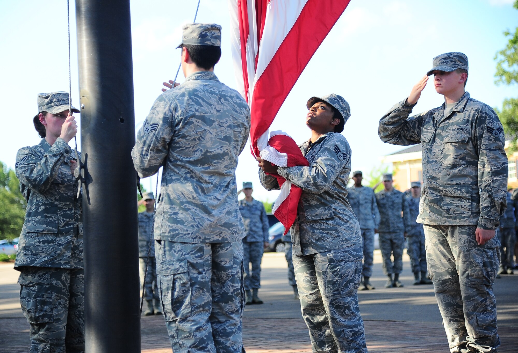 Airmen currently attending Airman Leadership School lower and collect the U.S. Flag during a retreat ceremony at Columbus Air Force Base, Aug. 21. ALS is a six-week course that teaches Airmen the fundamentals of leadership. The ALS students currently at Columbus are set to graduate Sept. 3. (U.S. Air Force photo/Airman 1st Class Daniel lile)